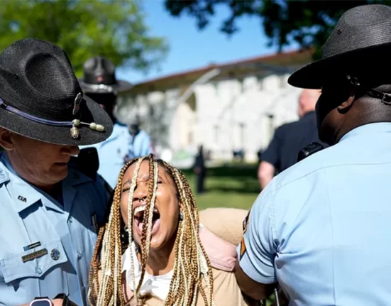 Georgia State Patrol officers detain a demonstrator on the campus of Emory University in Atlanta during a pro-Palestinian demonstration on Thursday. Mike Stewart/AP