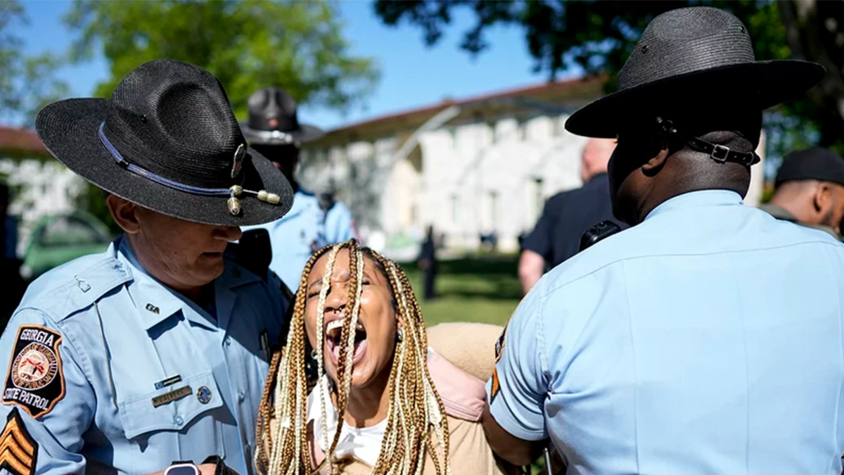 Georgia State Patrol officers detain a demonstrator on the campus of Emory University in Atlanta during a pro-Palestinian demonstration on Thursday. Mike Stewart/AP